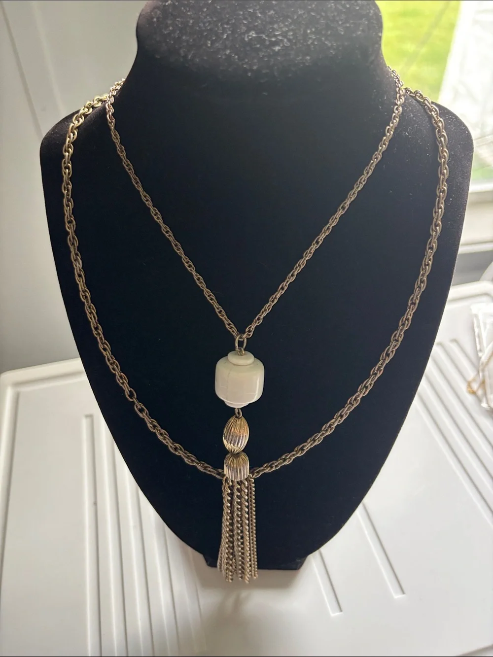 Gold-Tone Double Chain Necklace with White Bead and Tassel Pendant